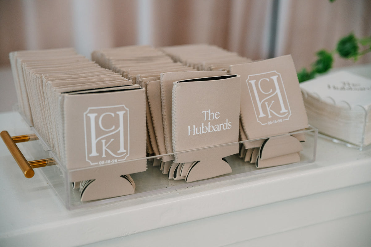 Custom neoprene koozies stacked for guests